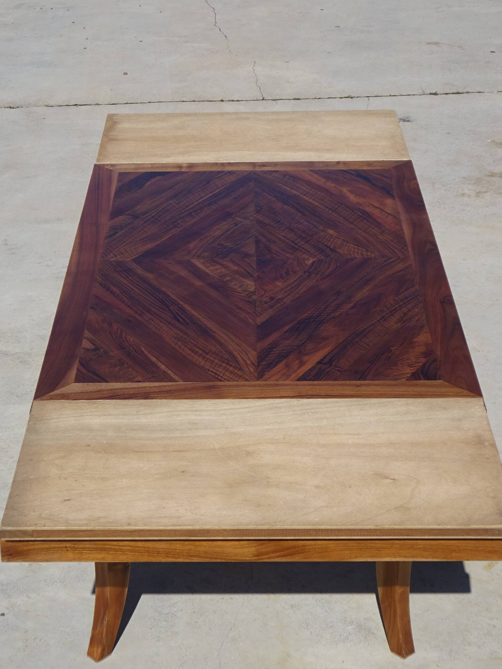 Antique solid walnut table with marquetry and extensions.