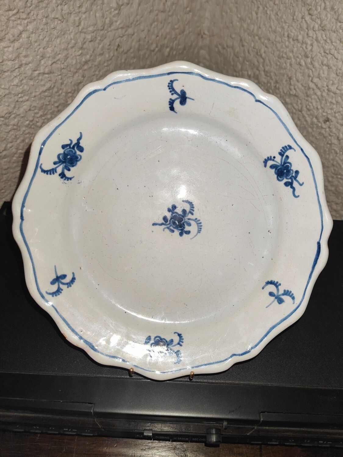 Old plate in Northern earthenware with blue floral decoration eighteenth century
