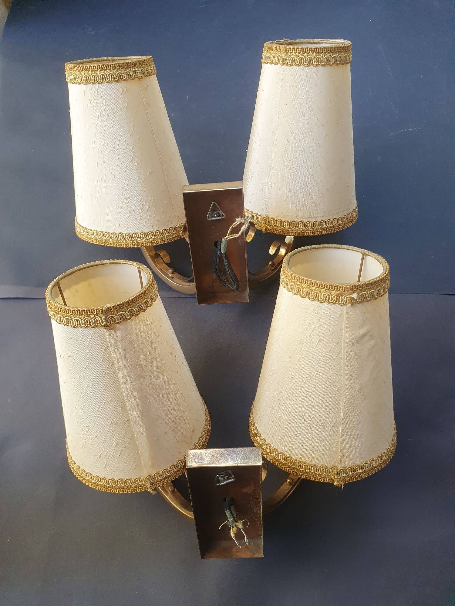 Pair of bronze wall sconces with 1940s Art Deco lampshades.