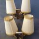 Pair of bronze wall sconces with 1940s Art Deco lampshades.
