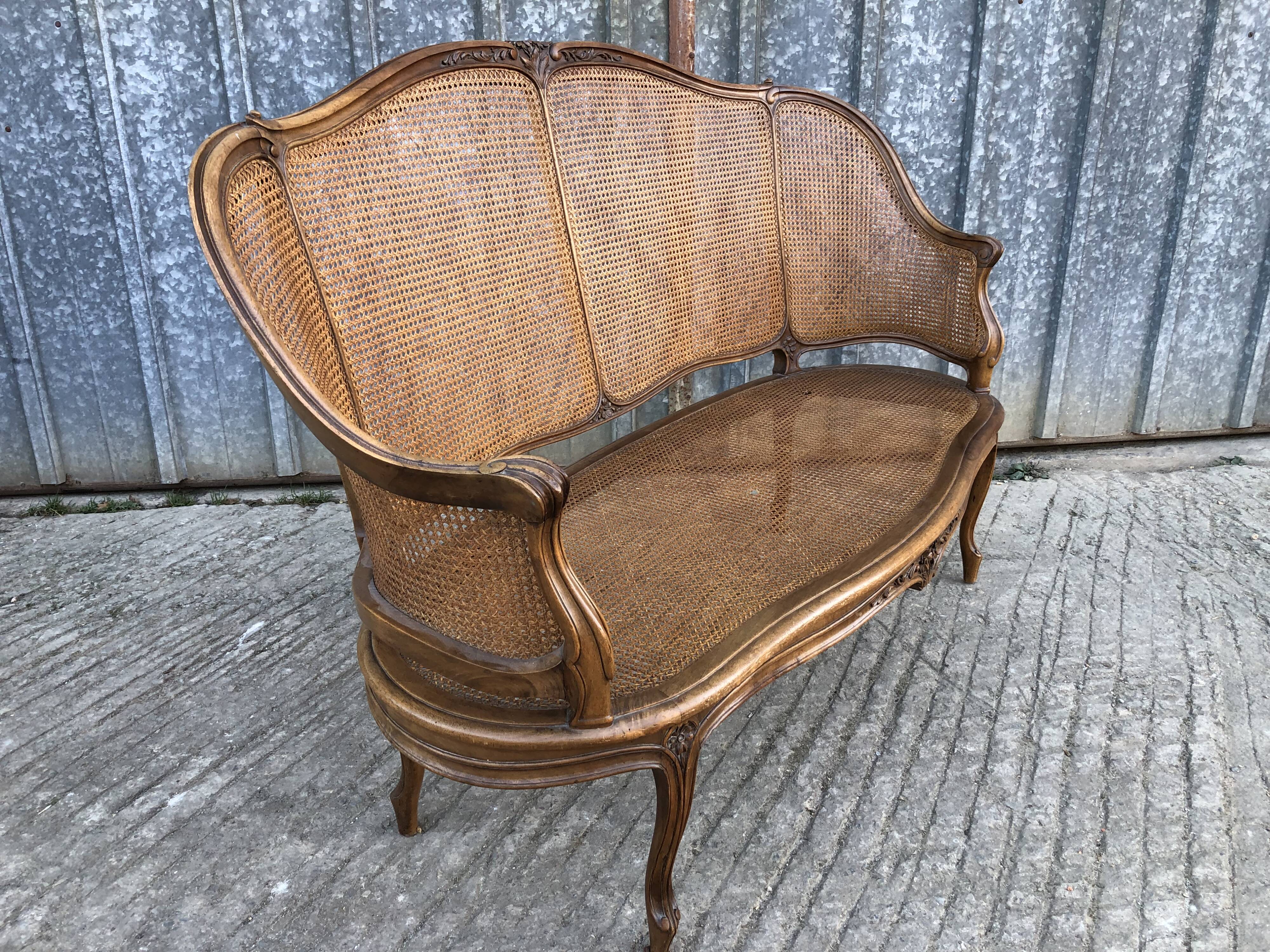Antique Louis XV bench in solid walnut and caning
