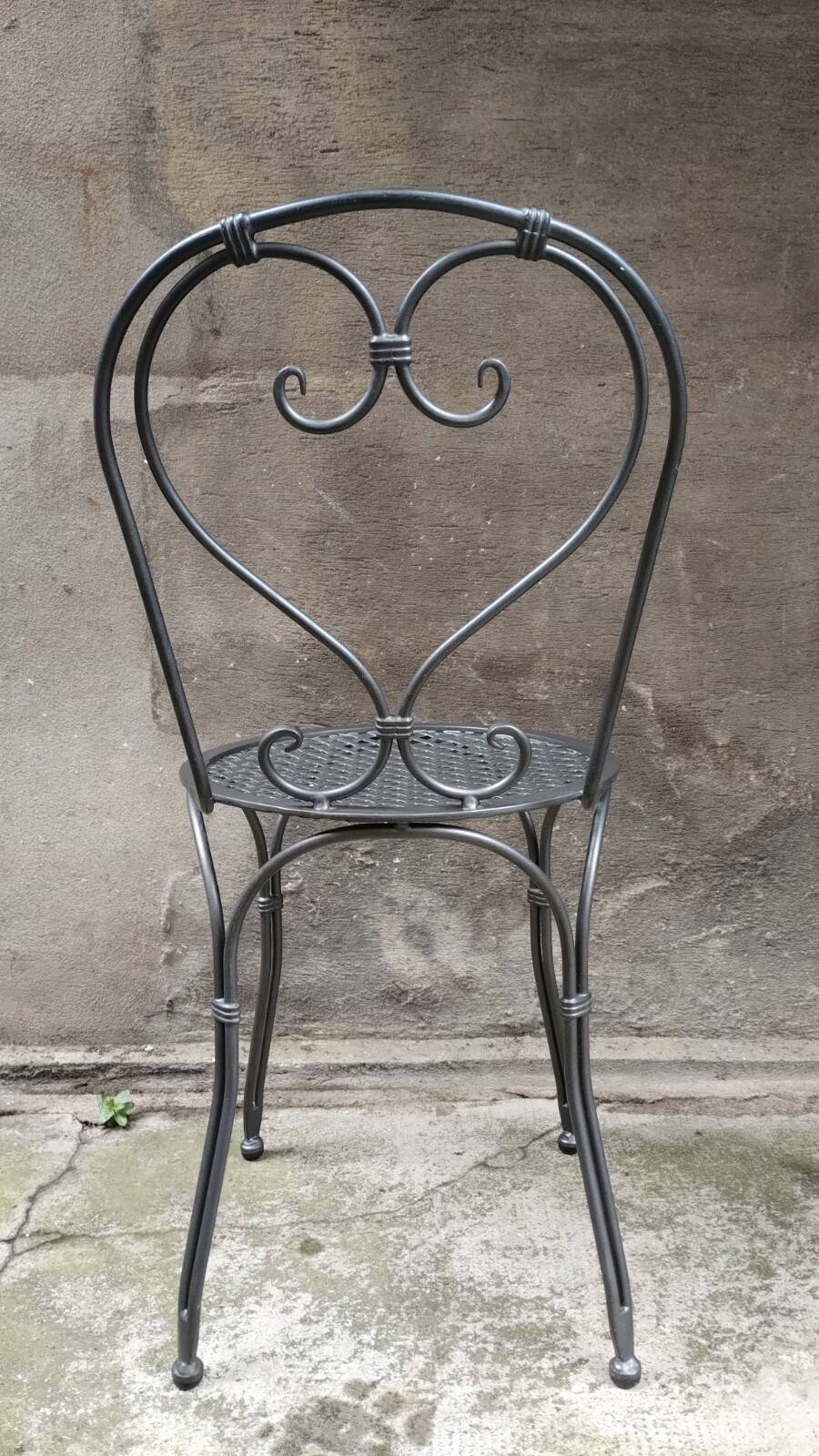 Dark gray wrought iron chair