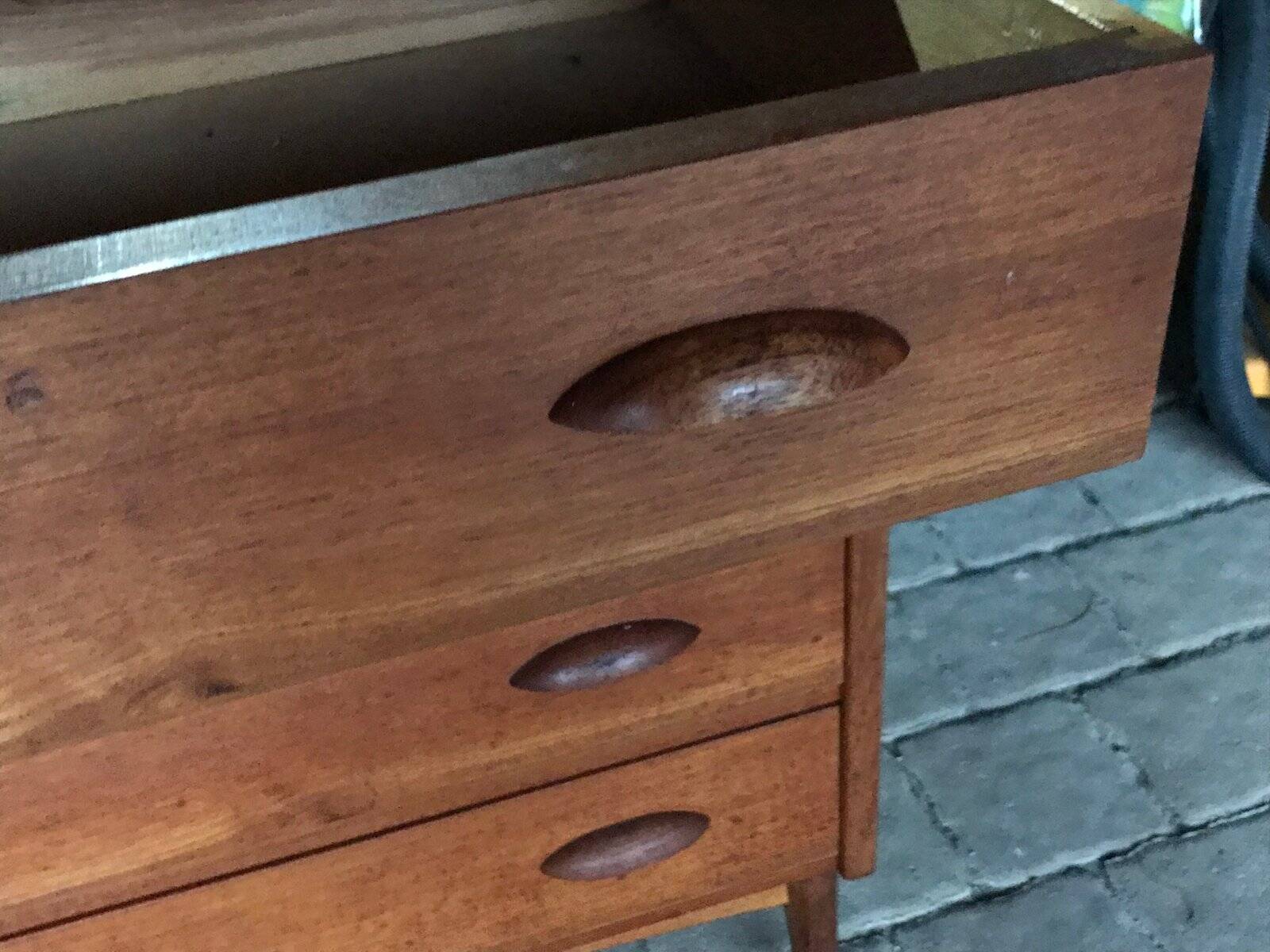 Danish commode from the 1960s in brown teak, with 4 drawers and elegant tapered legs.