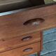 Danish commode from the 1960s in brown teak, with 4 drawers and elegant tapered legs.