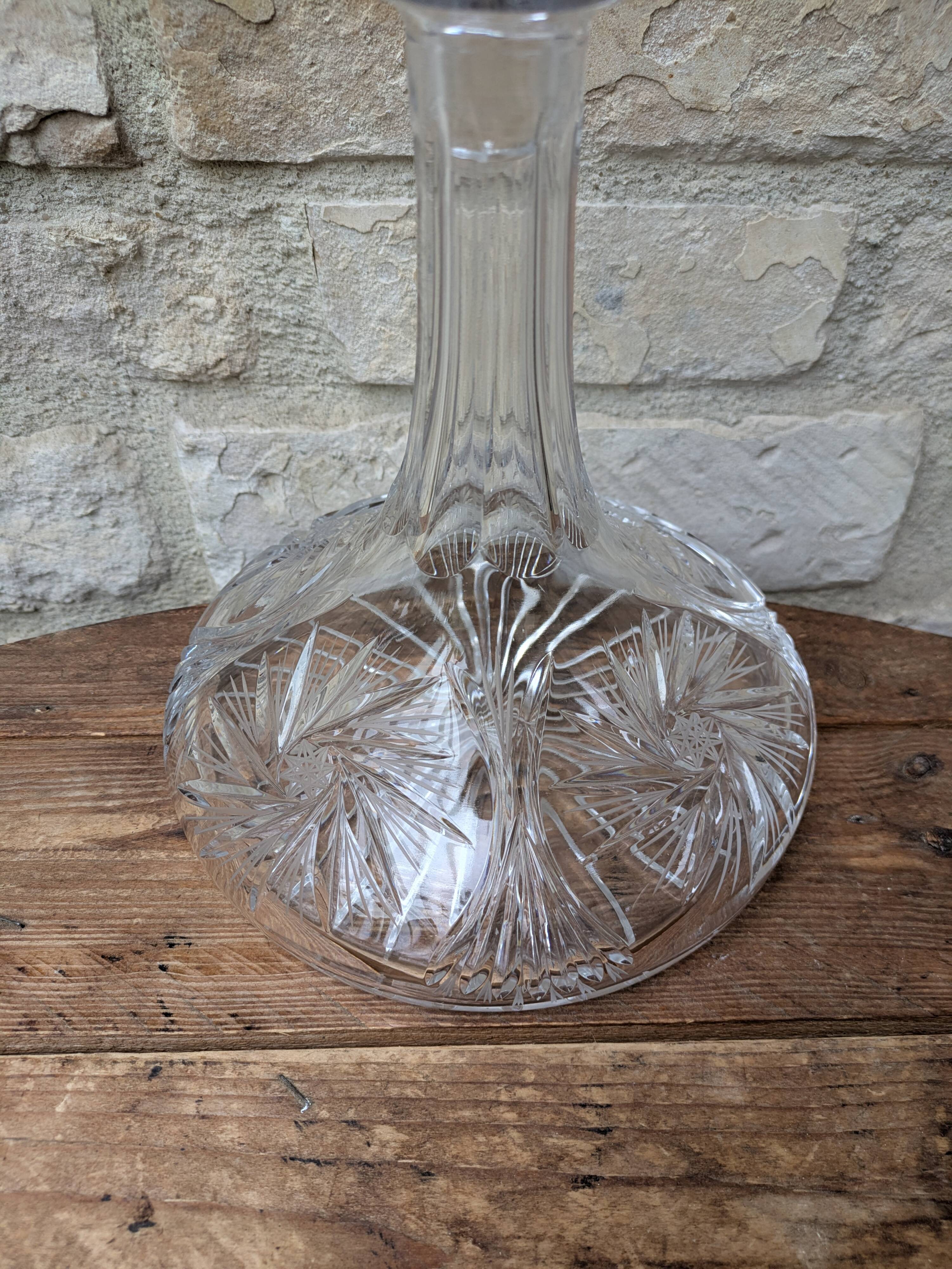 Antique cut crystal decanter with stopper.