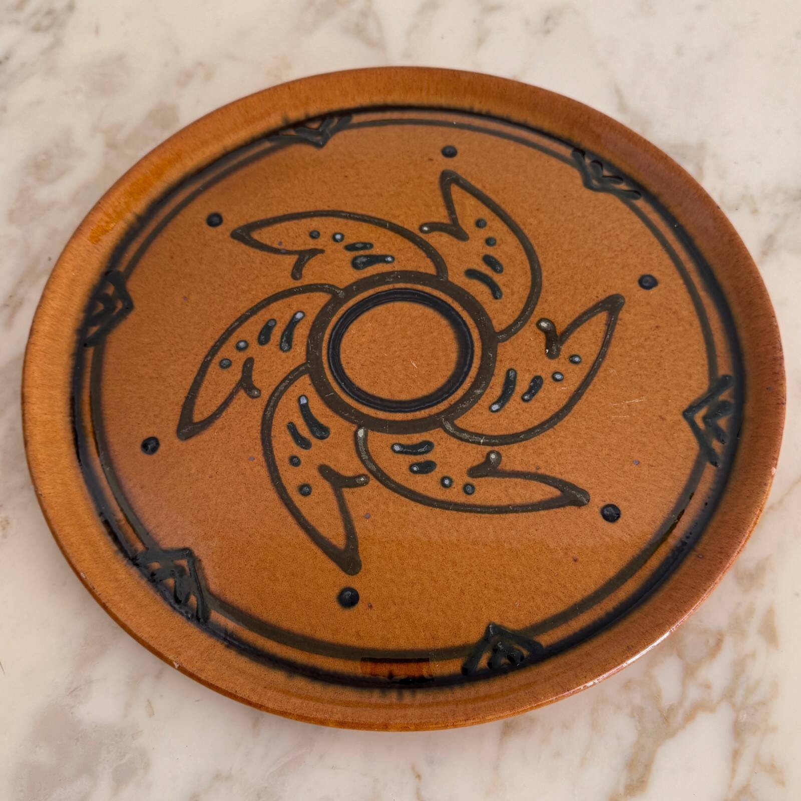 Round glazed earthenware dish by Biot, 20th century, stylized decoration