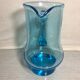 Old blue blown glass pitcher with vintage handle
