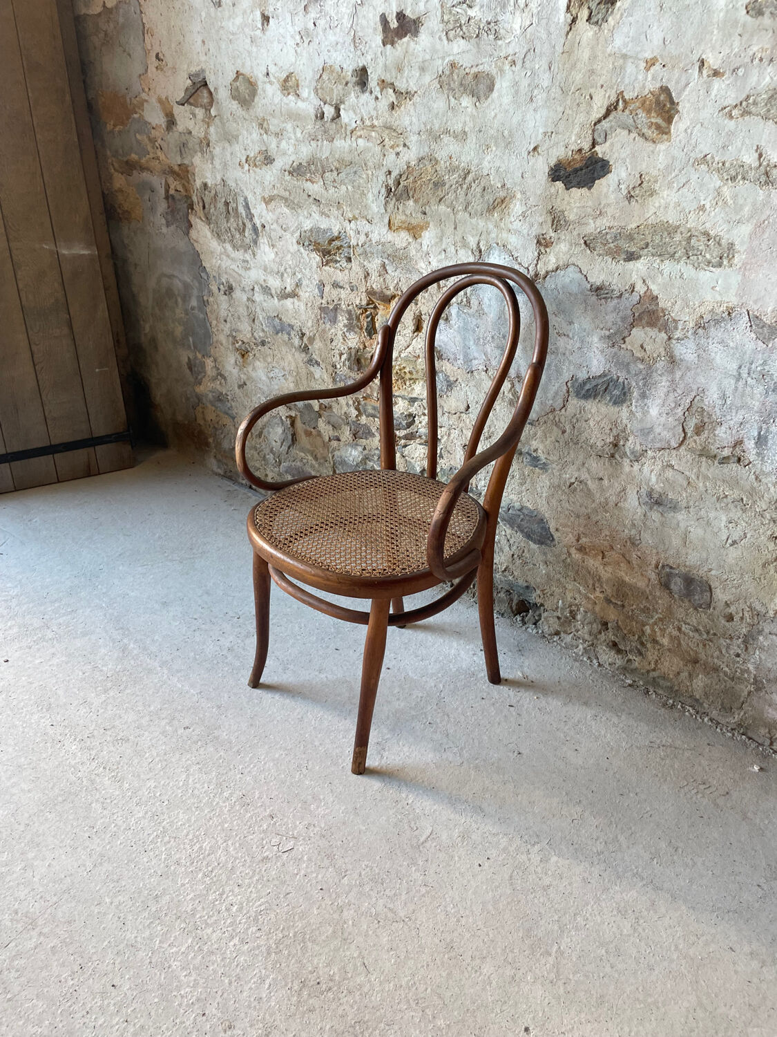 Thonet armchair with bent wood and caning