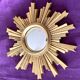 Golden wood “witch’s eye” sun mirror