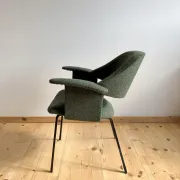 Curved vintage wool armchair from the 1960s