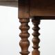 Antique English drop-leaf dining table made of walnut with elegant legs