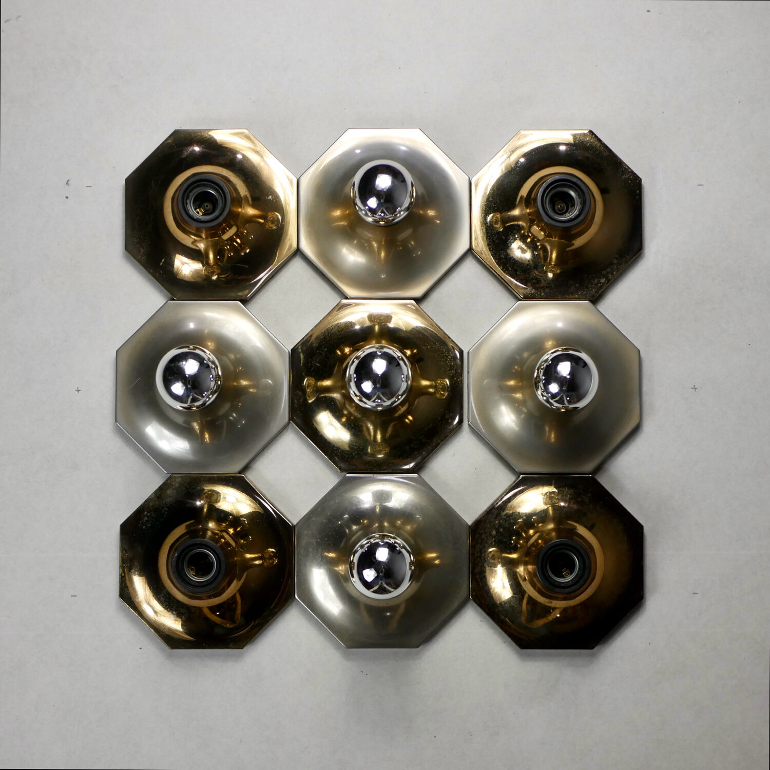 Suite of 11 octagonal brass wall lamps by Motoko Ishii