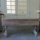 Console table in walnut with drop-leaf extensions, grey patinated base.