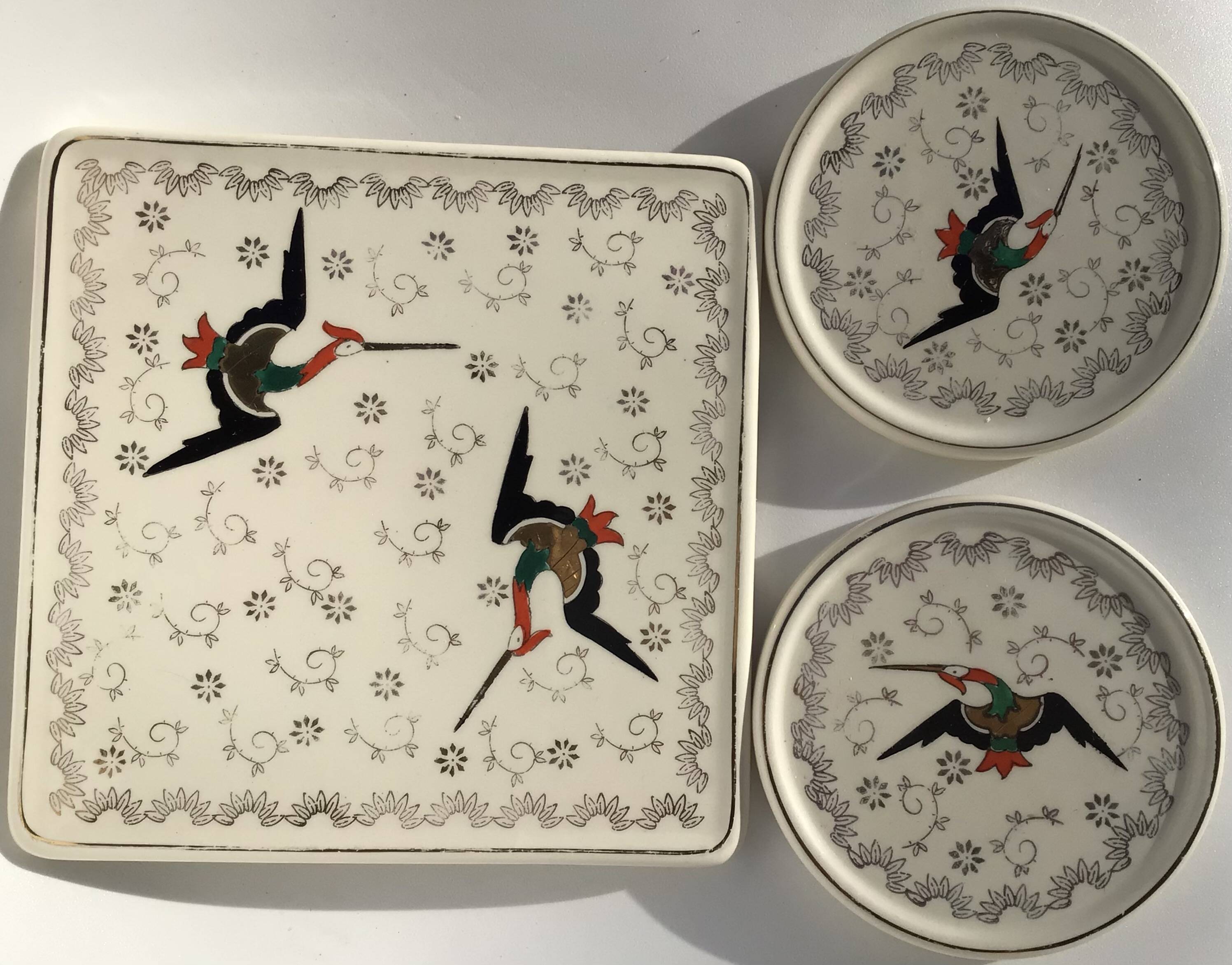 Longwy Chypre cream trivets and bottles