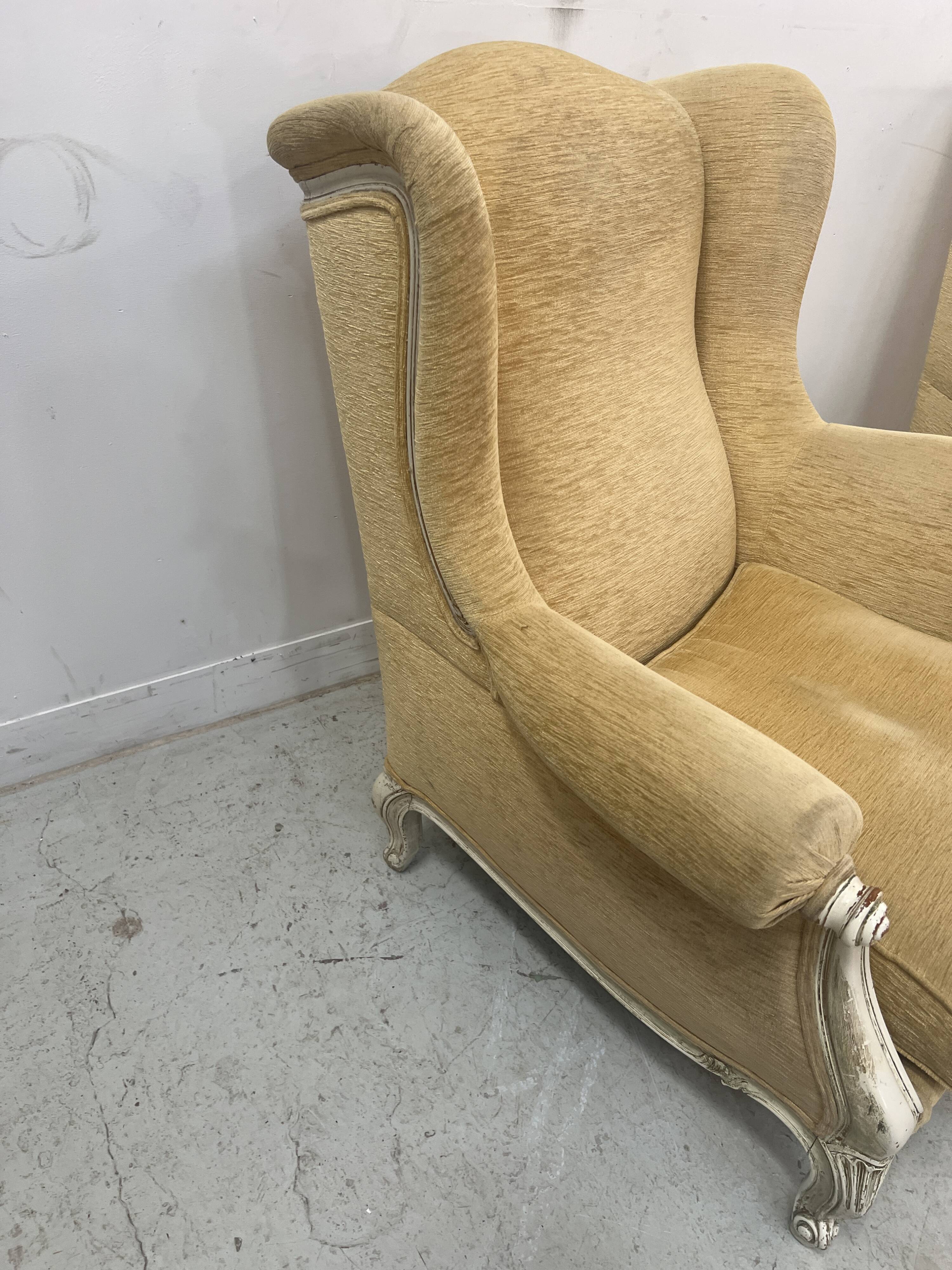 Pair of Louis XV style wing chairs in patinated beech, 20th century