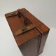 Rectangular wooden suitcase covered with leather