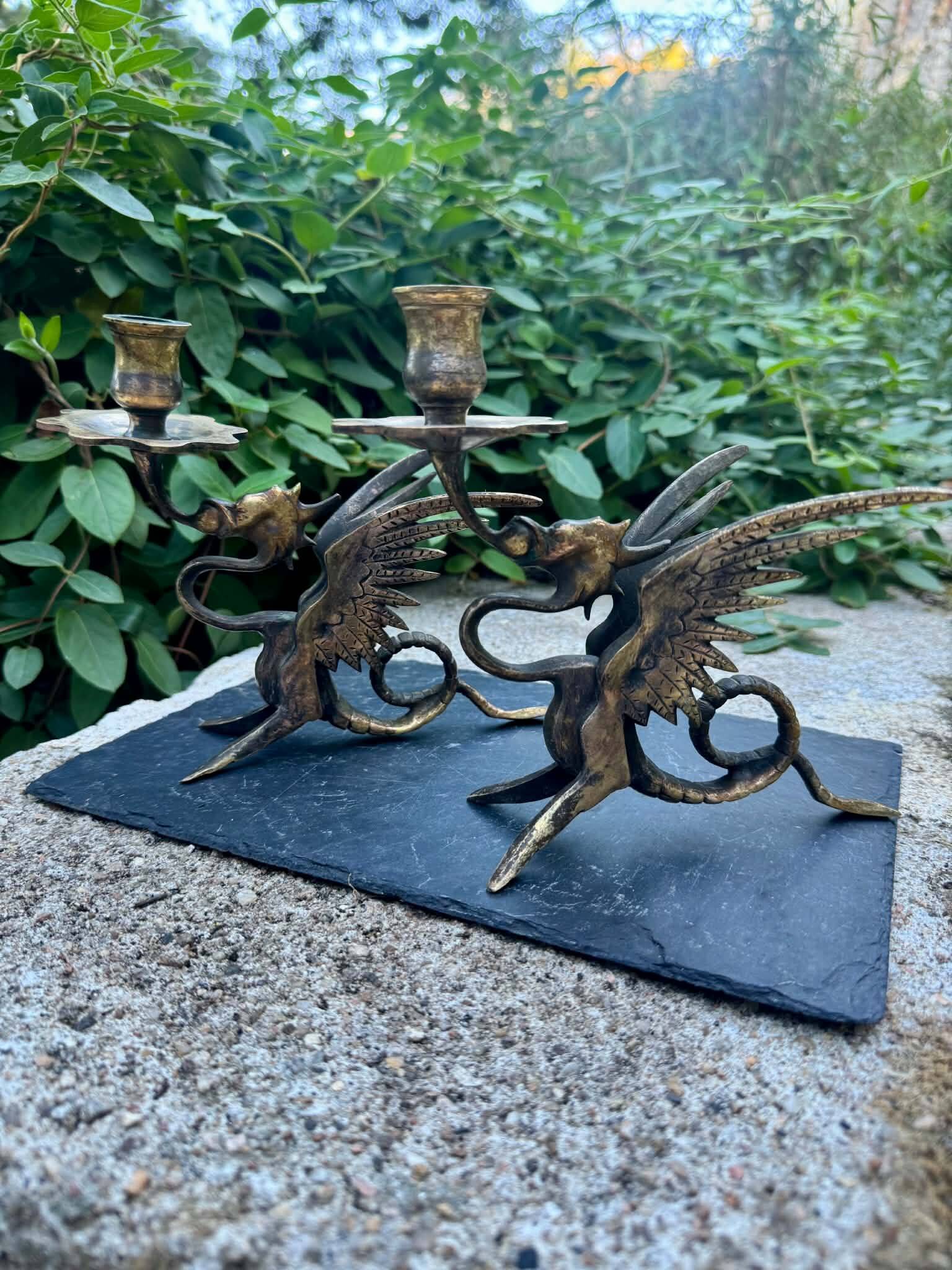 Pair of chimera candle holders in bronze, 19th century.
