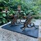 Pair of chimera candle holders in bronze, 19th century.
