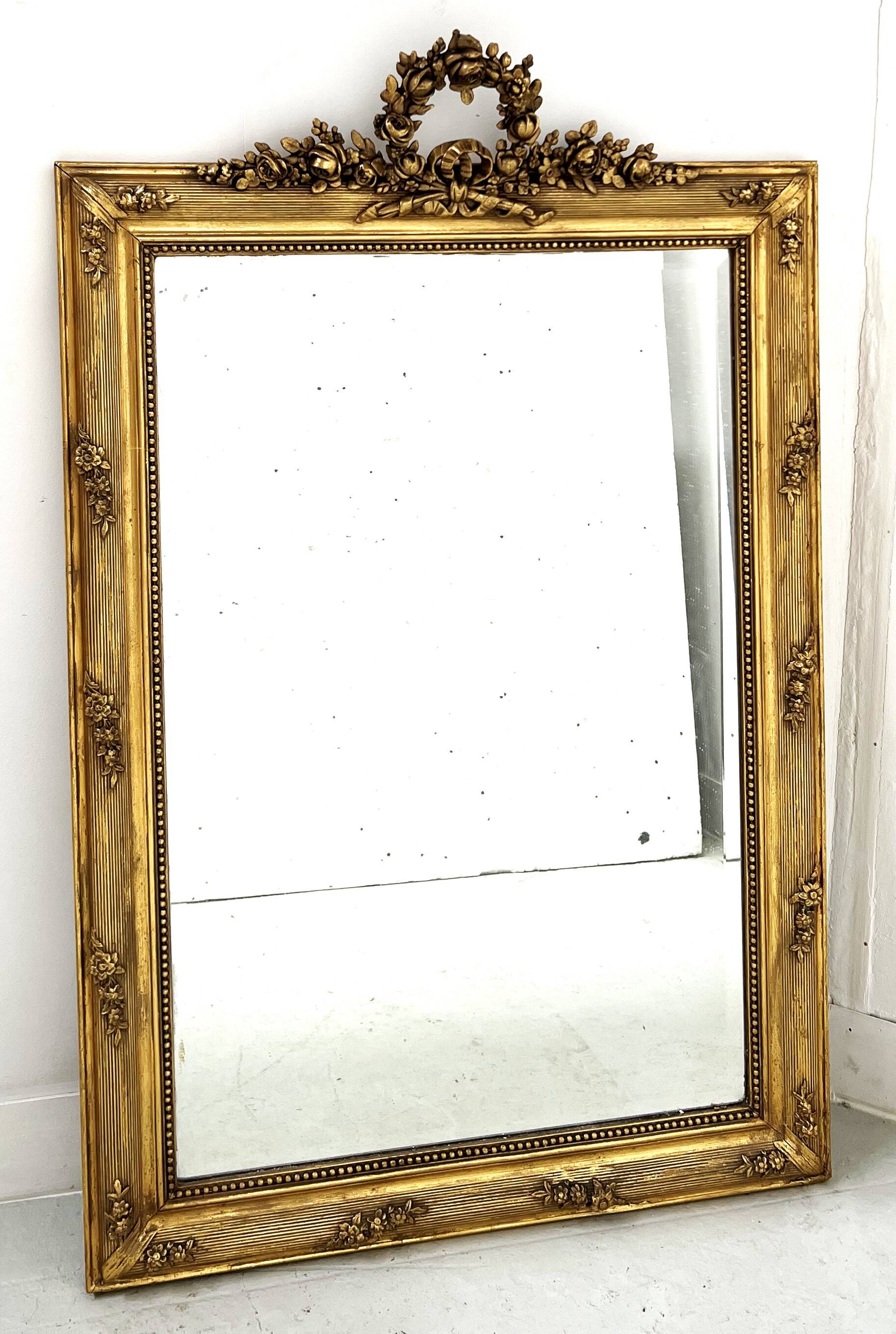 Louis XVI style mirror in wood and gilded stucco, 19th century
