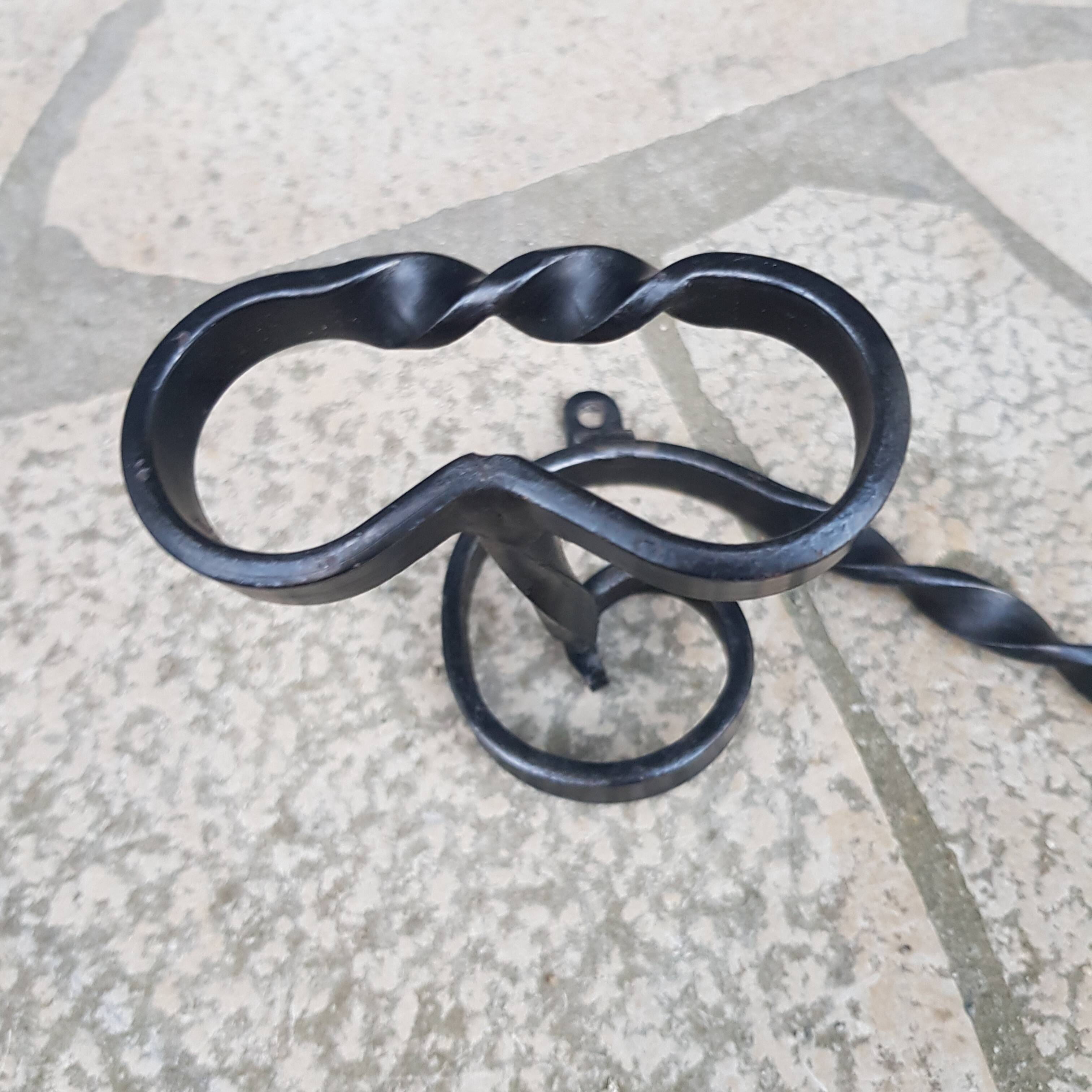 Wrought iron wall coat rack