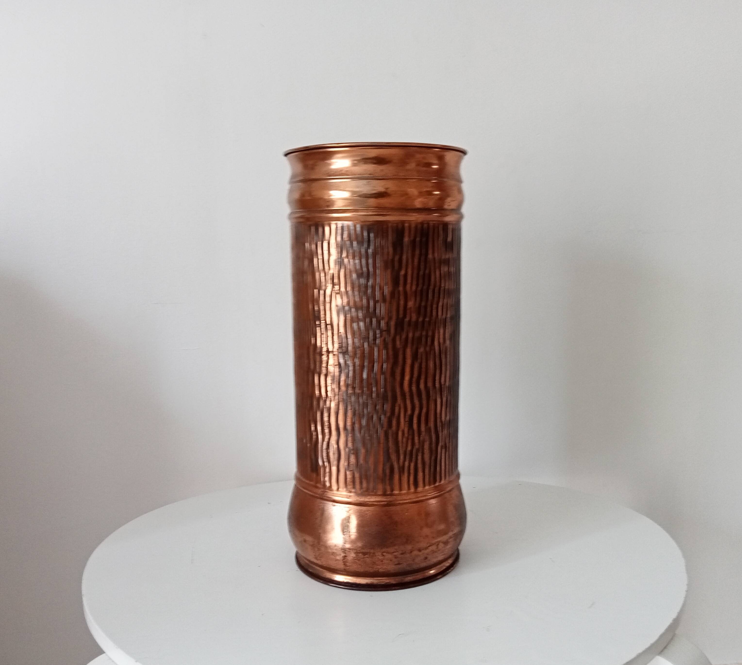 Vintage brutalist umbrella stand in hammered copper with a wood effect.