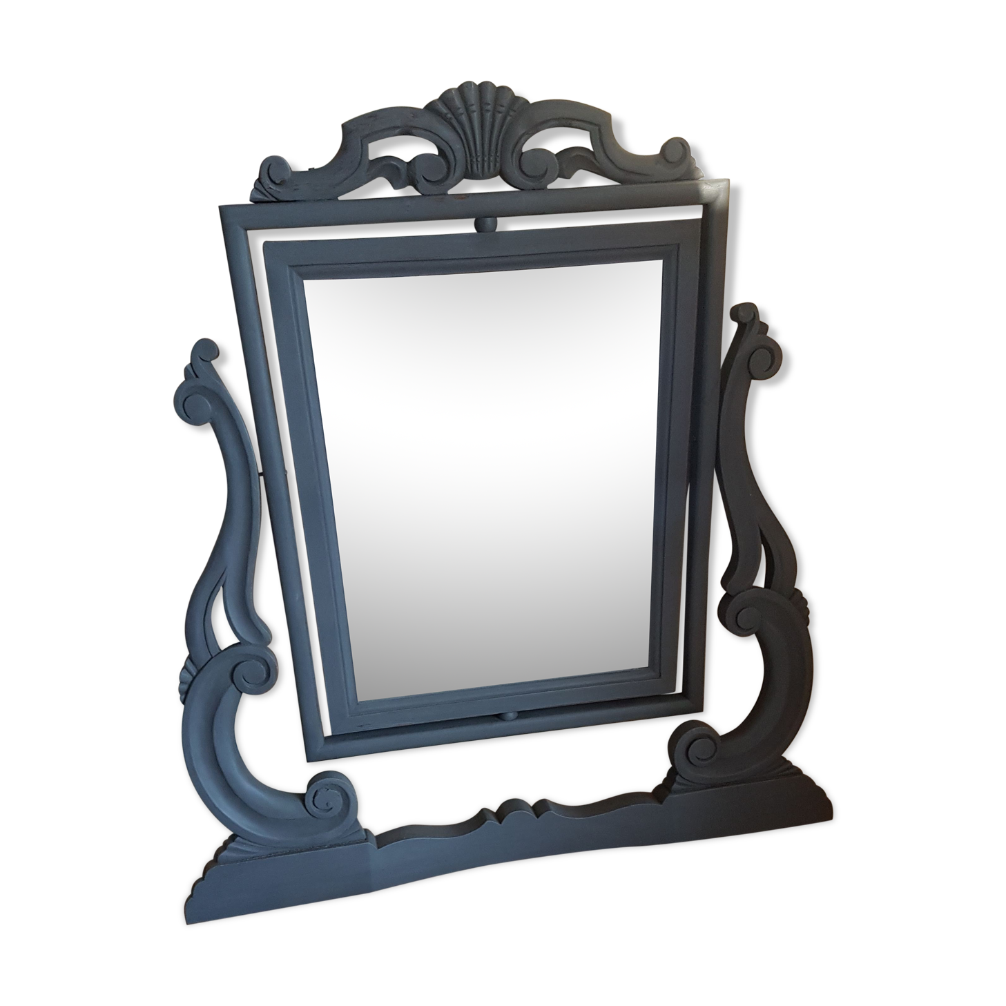 Rocking patinated wood mirror