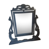 Rocking patinated wood mirror