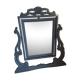 Rocking patinated wood mirror