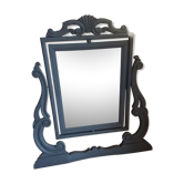 Rocking patinated wood mirror