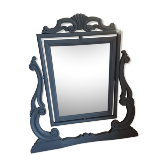 Rocking patinated wood mirror