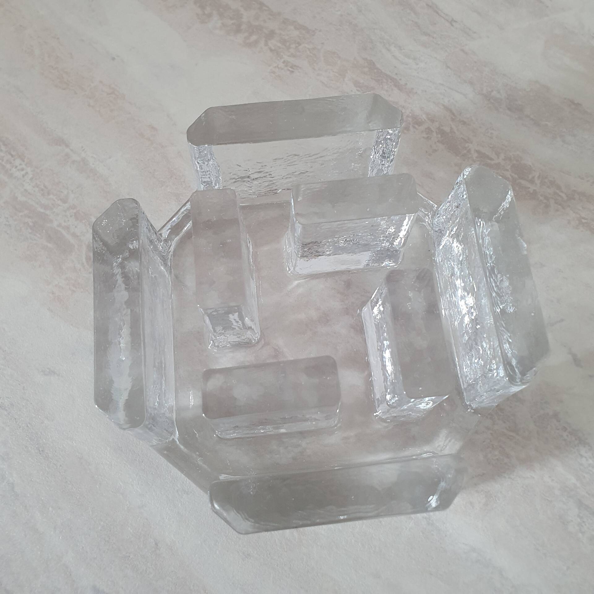 Candle holder or glass warmer with irregular ice effect.
