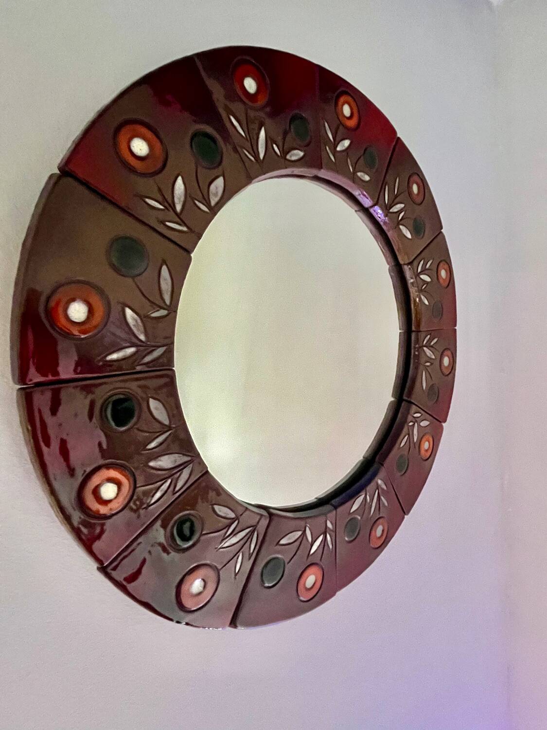 Oswald Tieberghien round ceramic mirror