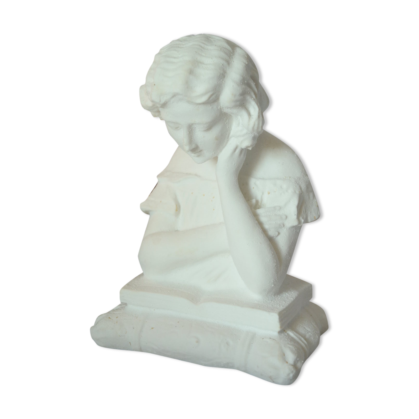 Limestone bust young girl who reads