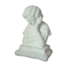 Limestone bust young girl who reads