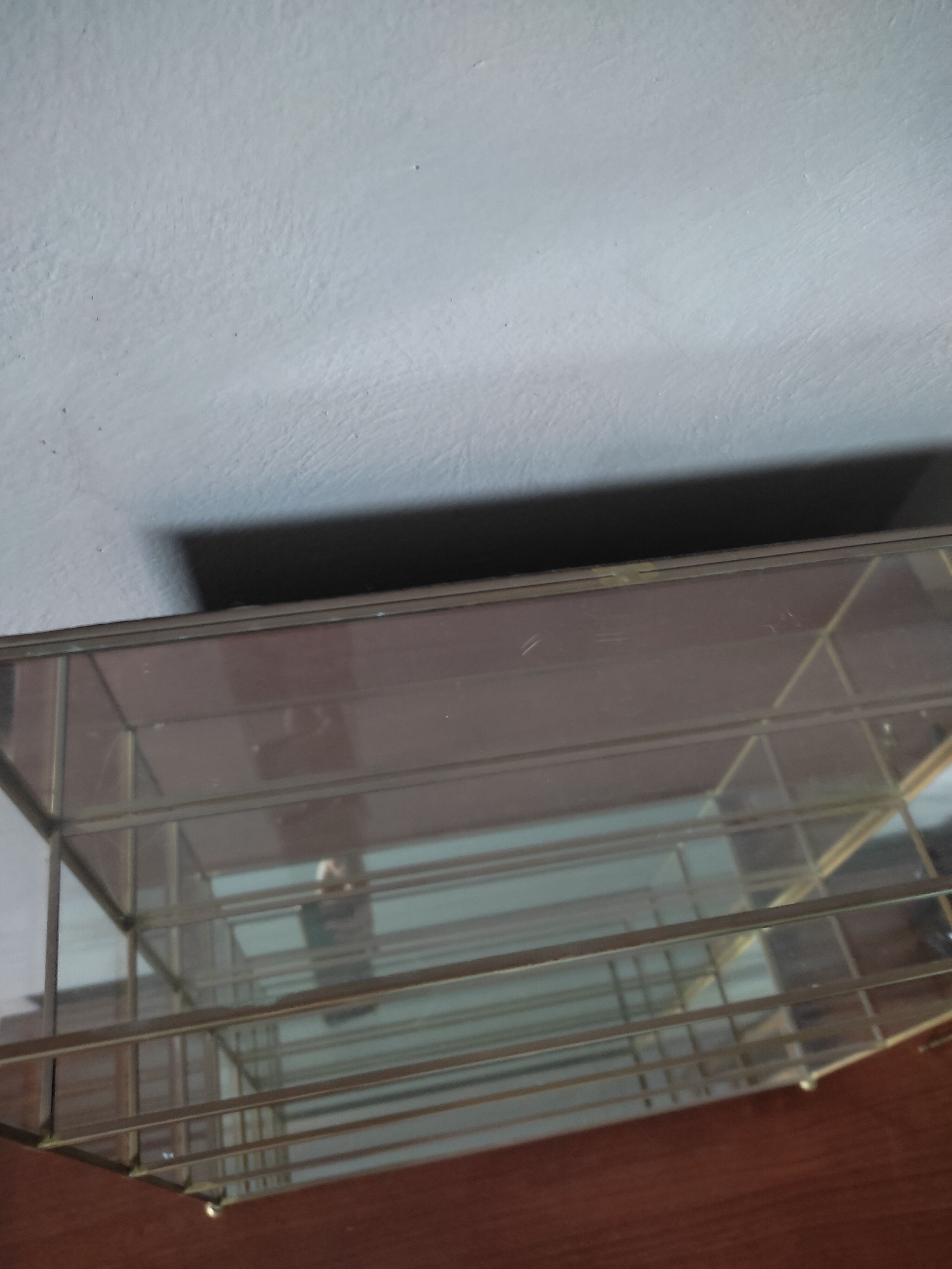 Glazed brass shelf to install