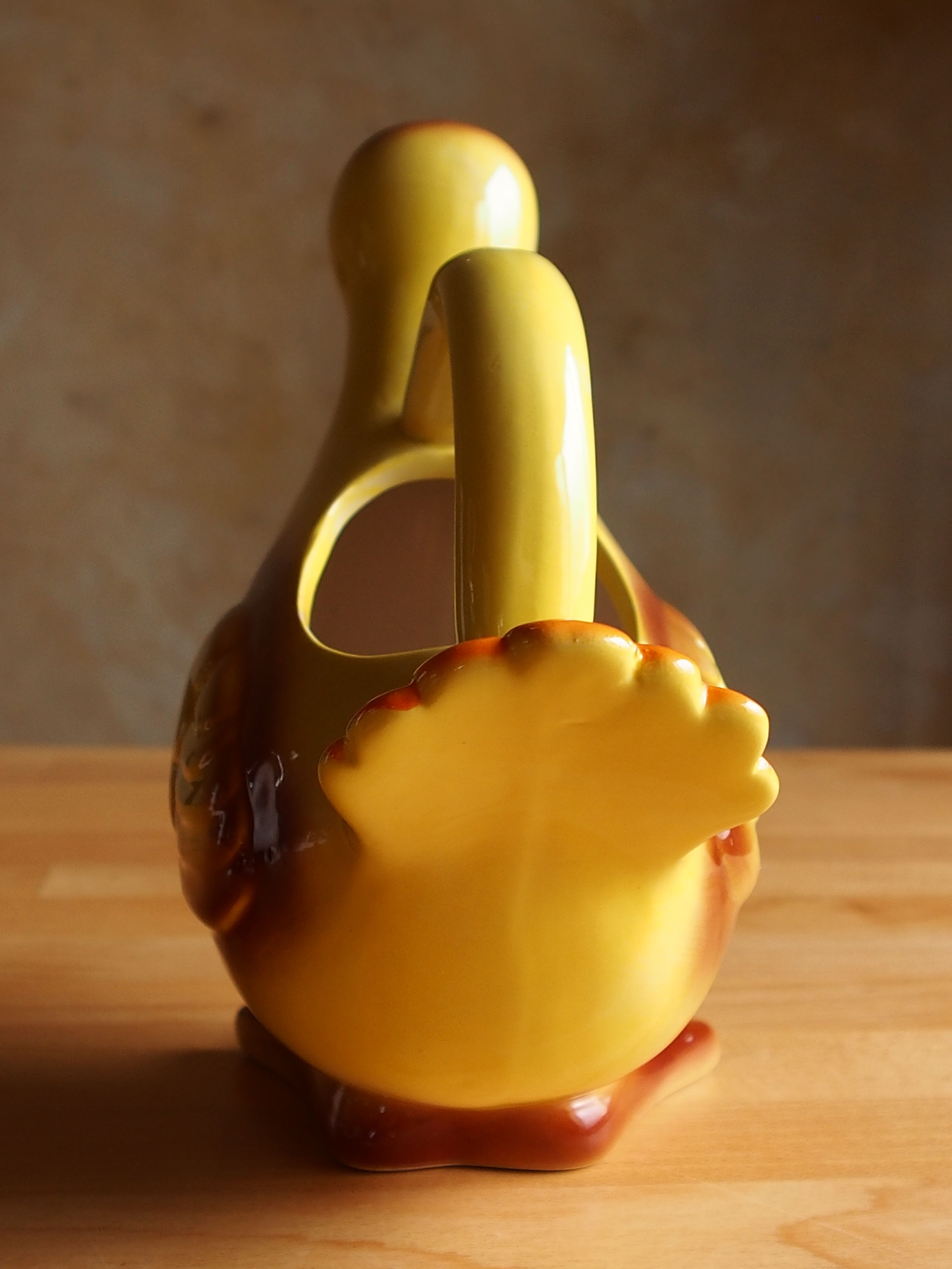 Ceramic watering can in white earthenware, yellow enamel and bird shape
