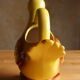 Ceramic watering can in white earthenware, yellow enamel and bird shape