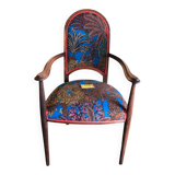 Art Nouveau armchair with a floral seat and backrest.