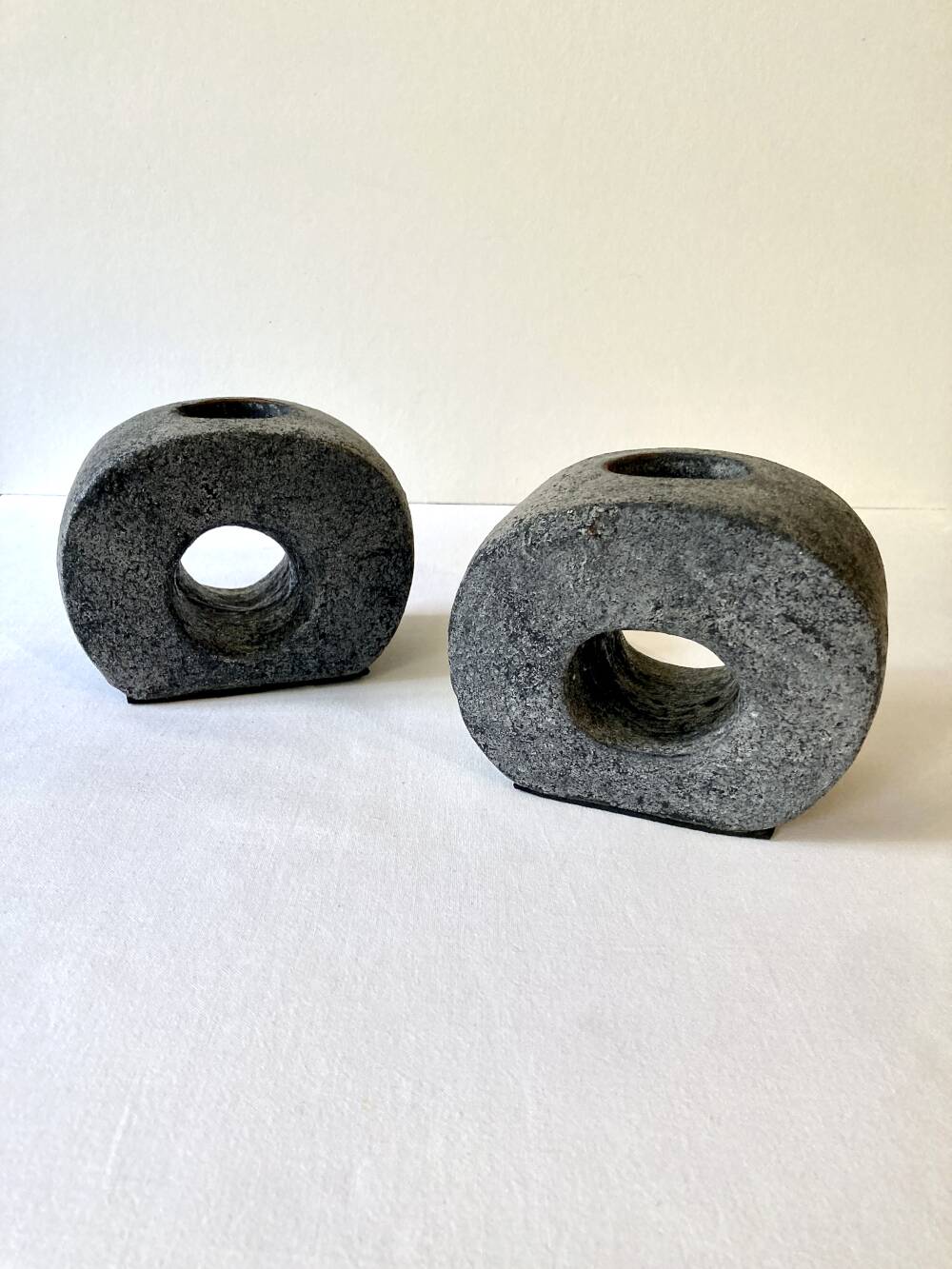 Pair of terracotta candle holders with anthracite finish, 1980s.