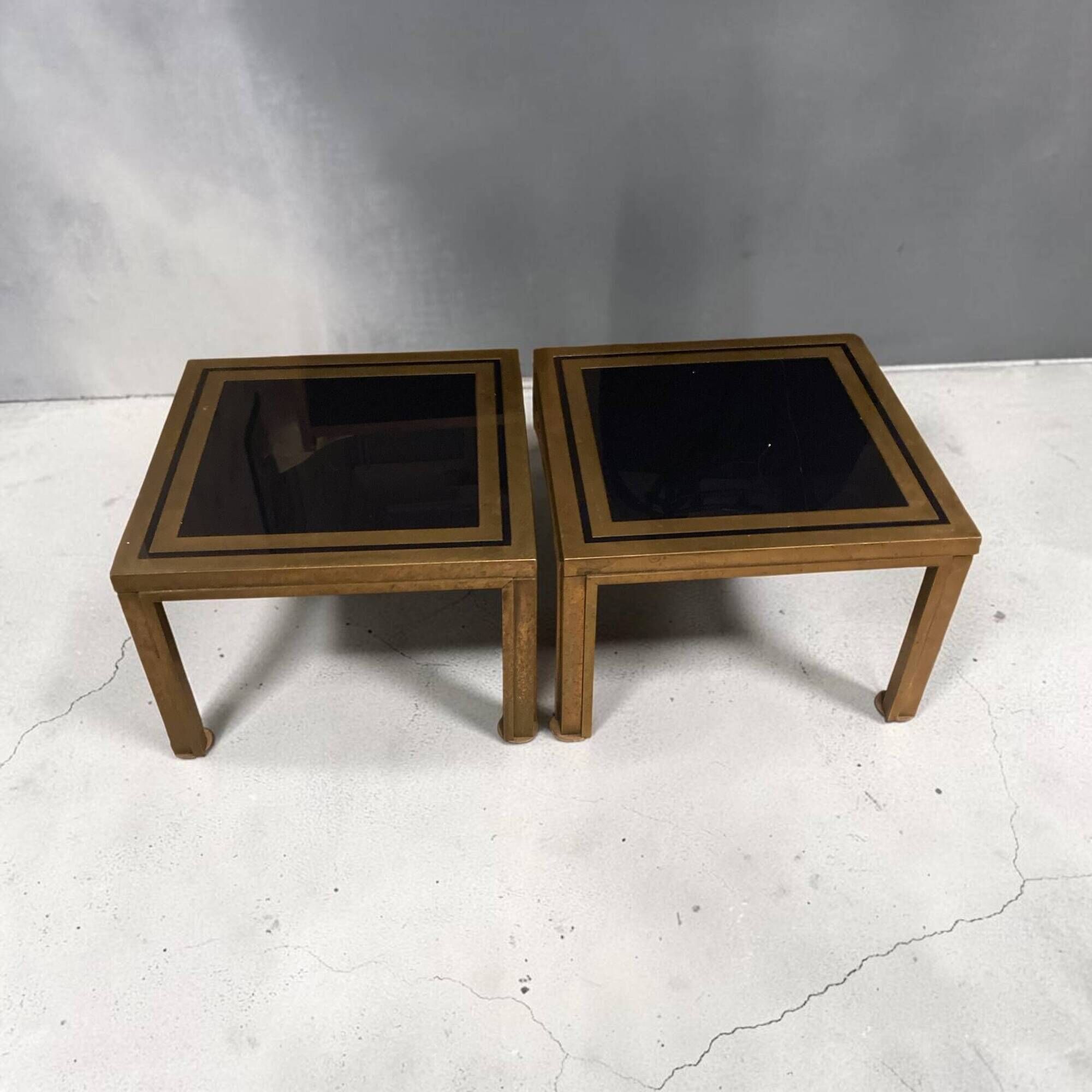 Pair of Romeo Rega side tables in brass and smoked glass, Italy 1970.