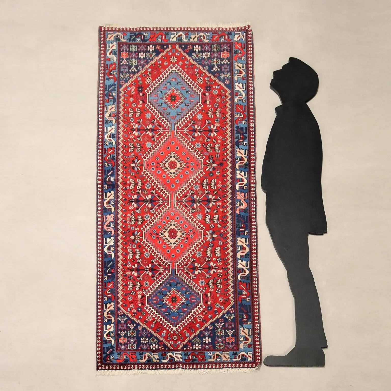 Ancient Asian wool rug, hand-knotted, 79 x 34 in.