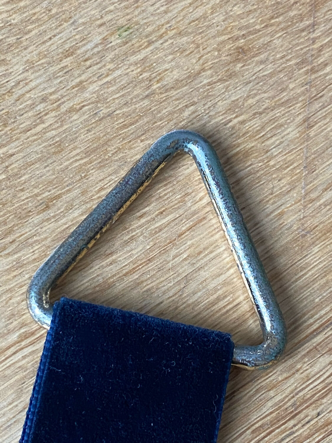 Vintage witch's eye curved mirror hangs velvet ribbon