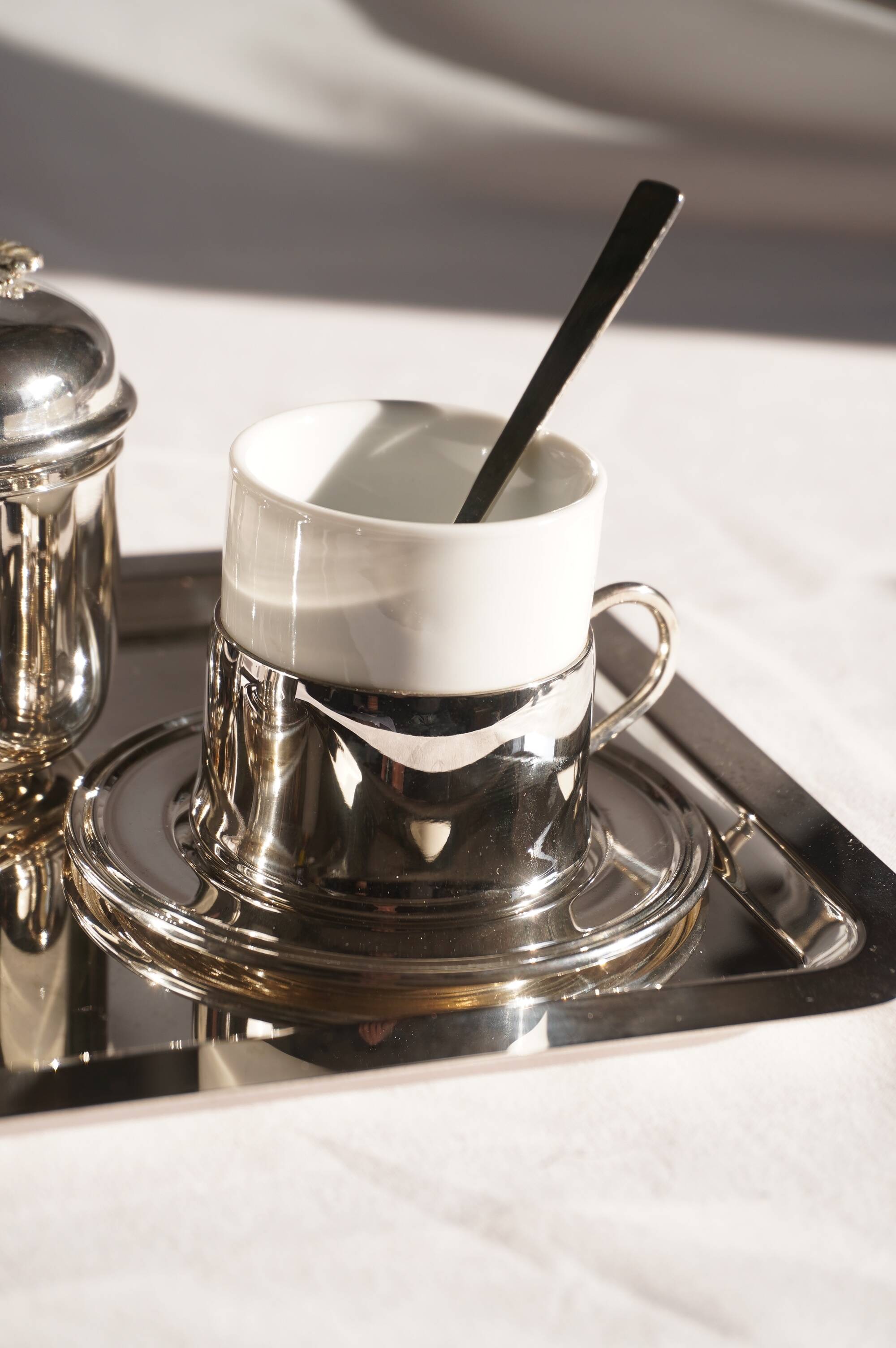 Silver-plated metal coffee service with a grape design.