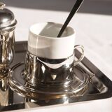 Silver-plated metal coffee service with a grape design.