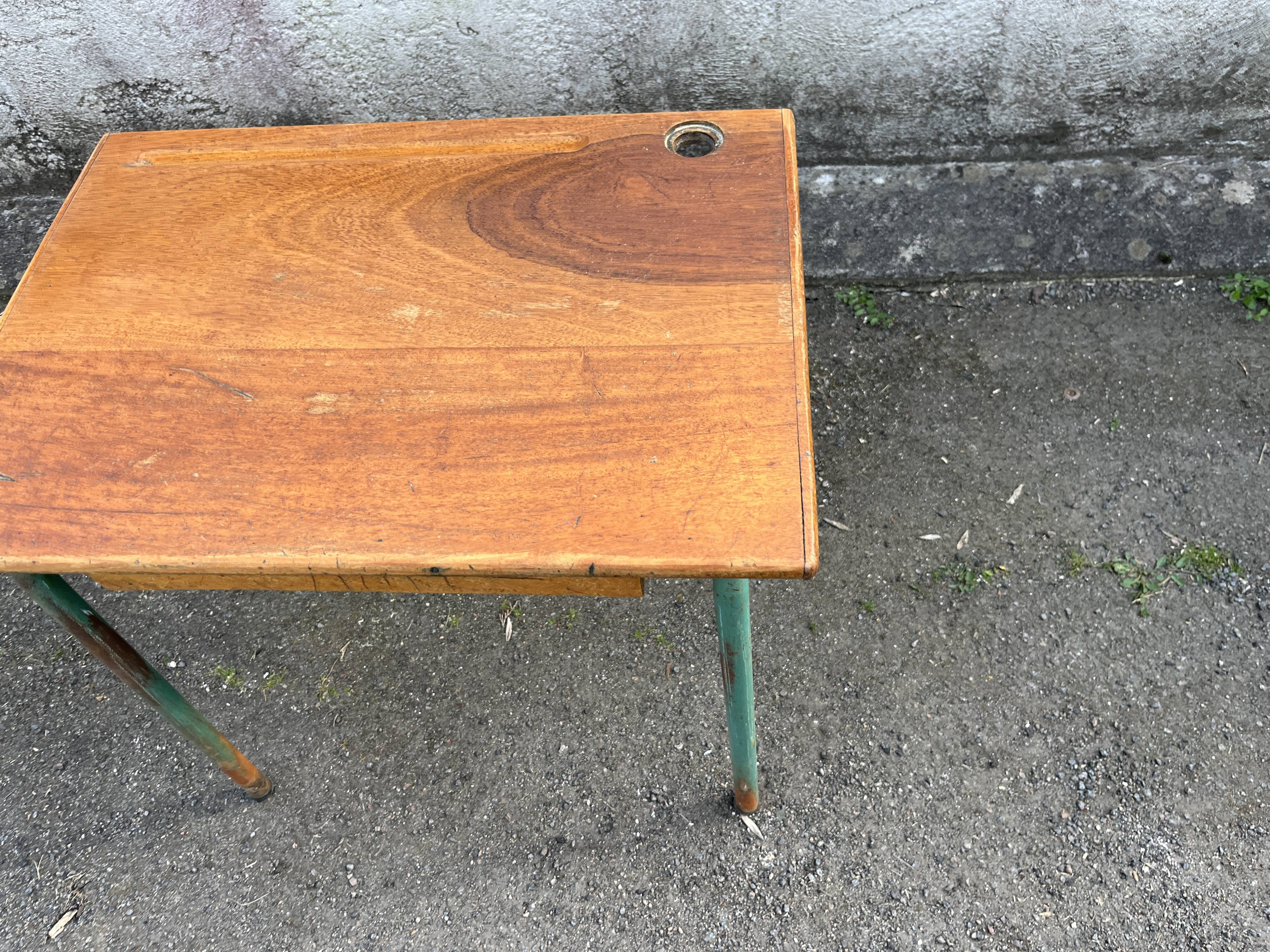 Vintage school desk made of wood and green metal - inkwell hole - antique.
