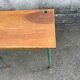Vintage school desk made of wood and green metal - inkwell hole - antique.