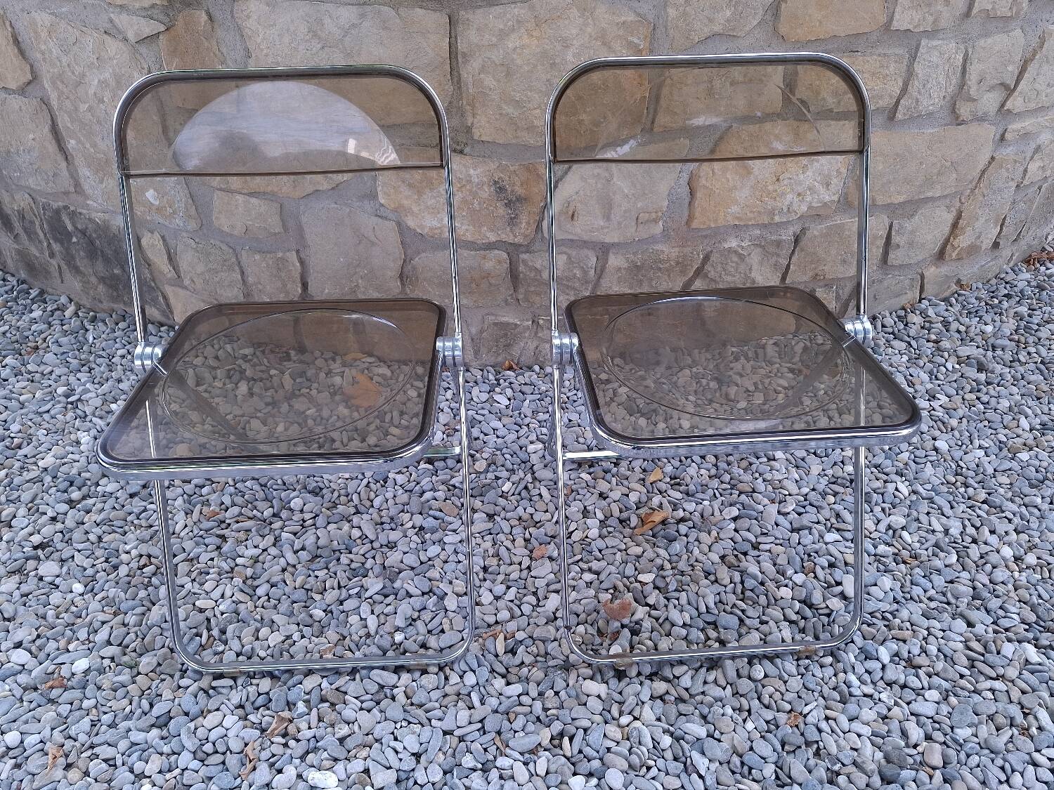 2 folding chairs designed by Giancarlo Piretti for Castelli