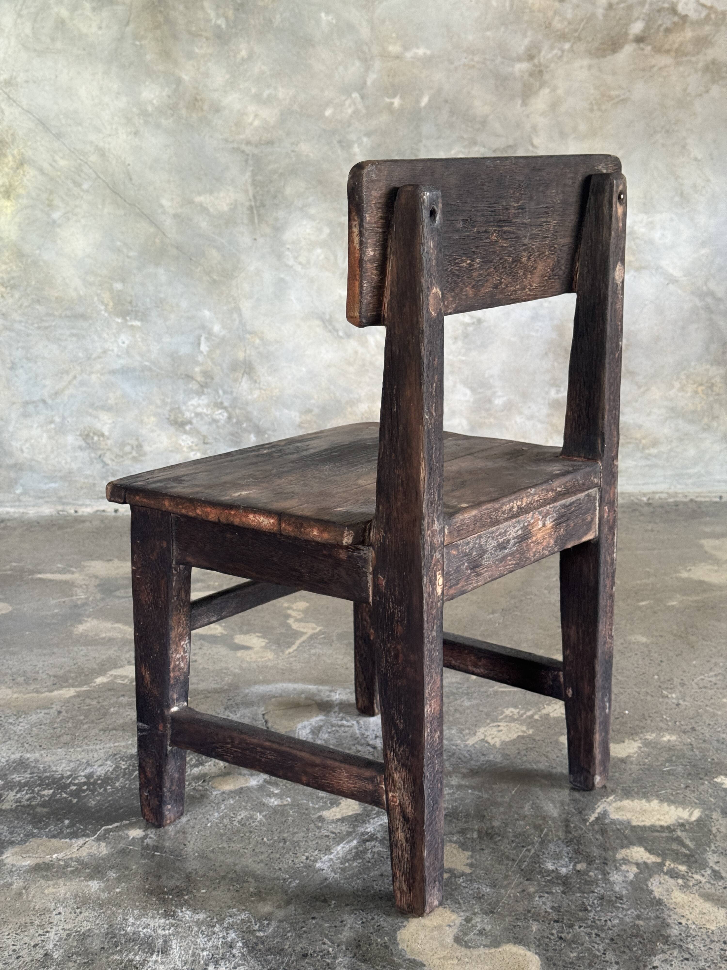 Small antique Indonesian children's chair in teak.