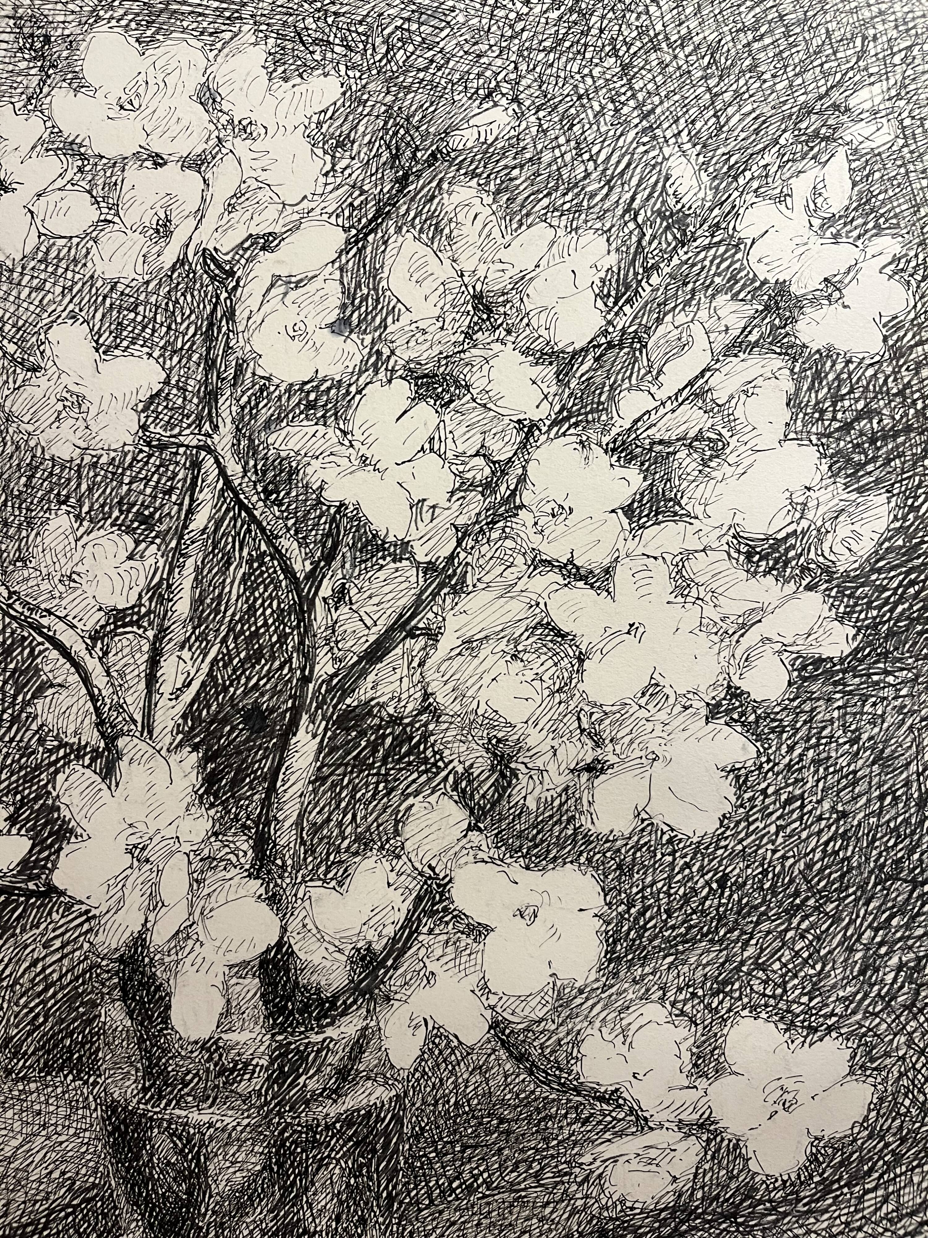 Almond branches in bloom in a glass of water