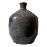 Glazed ceramic vase with a narrow neck and signed, unique piece.